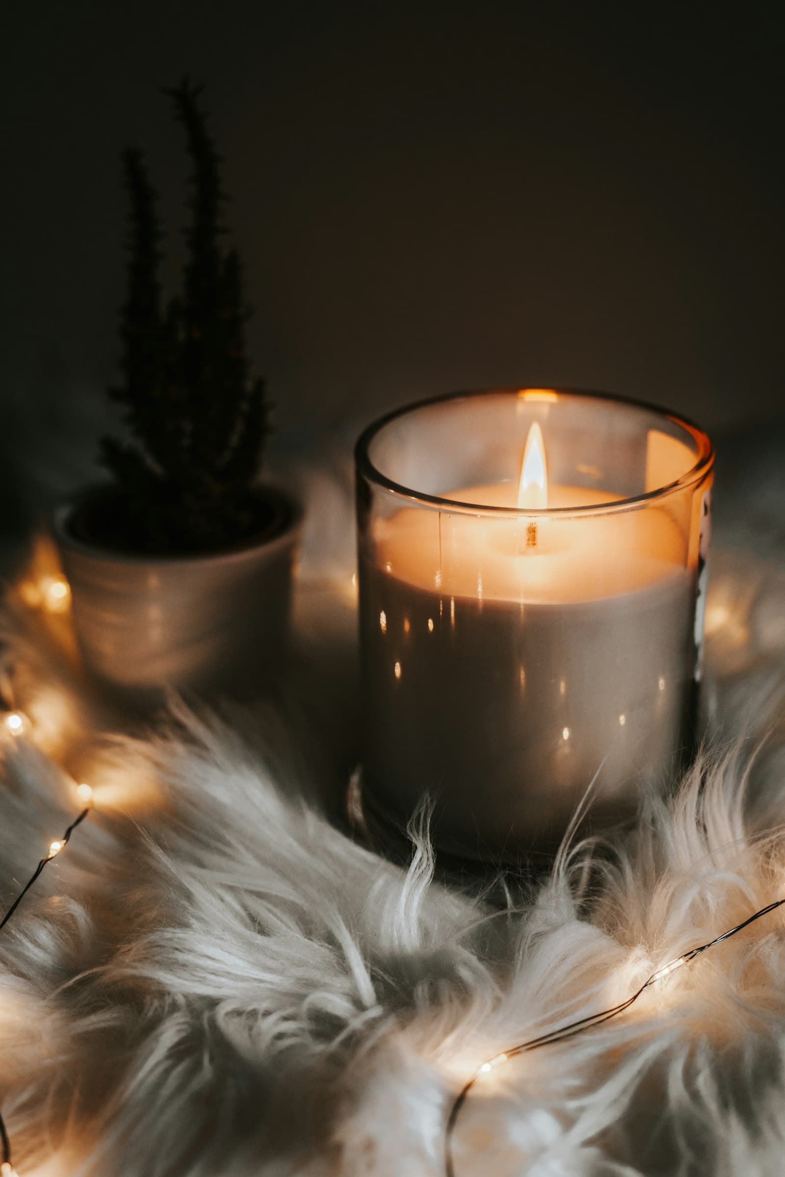 A hand-poured candle burning softly